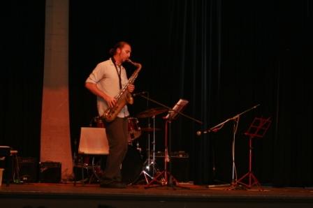 Wayne Rigby preparing his saxophone to accompany his students